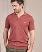 Polo en tricot rose